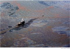 Oil floats on the surface of the Gulf of Mexico around a work boat at the site of the Deepwater Horizon oil spill in the Gulf of Mexico on June 2. As the desperate effort to contain the oil proceeded, the slick stretched farther. Tar balls and other oil d